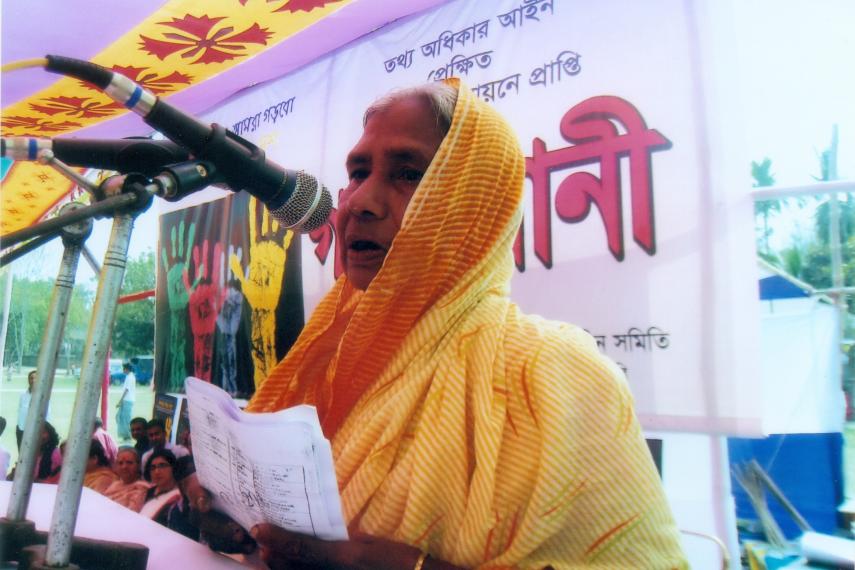 Promoting women’s leadership: elderly woman speaking at Nijera Kori public audit in 2012