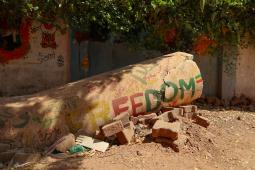 Photo of a fall pillar with "FREEDOM" written across it.