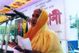 Promoting women’s leadership: elderly woman speaking at Nijera Kori public audit in 2012