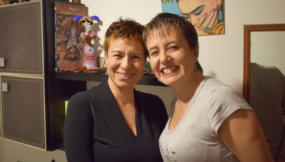 Two women, Adriana and Marcela, smiling together